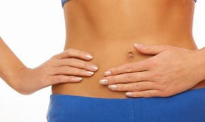 woman with hand on tummy